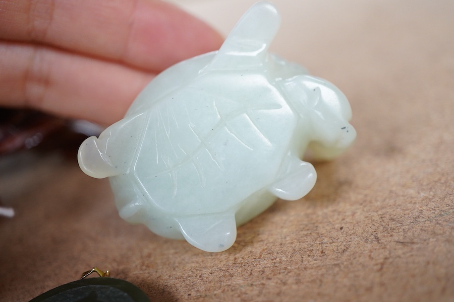 A Chinese carved jade pendant and two hardstone carved animals, pendant 3cm diameter.